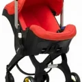 Возьмите Коляска-автокресло (автолюлька) Doona+ (0-13 кг)  (красный) напрокат (Фото 2) в Москве