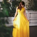 Возьмите Желтое вечернее платье с пышной юбкой напрокат (Фото 2) в Москве