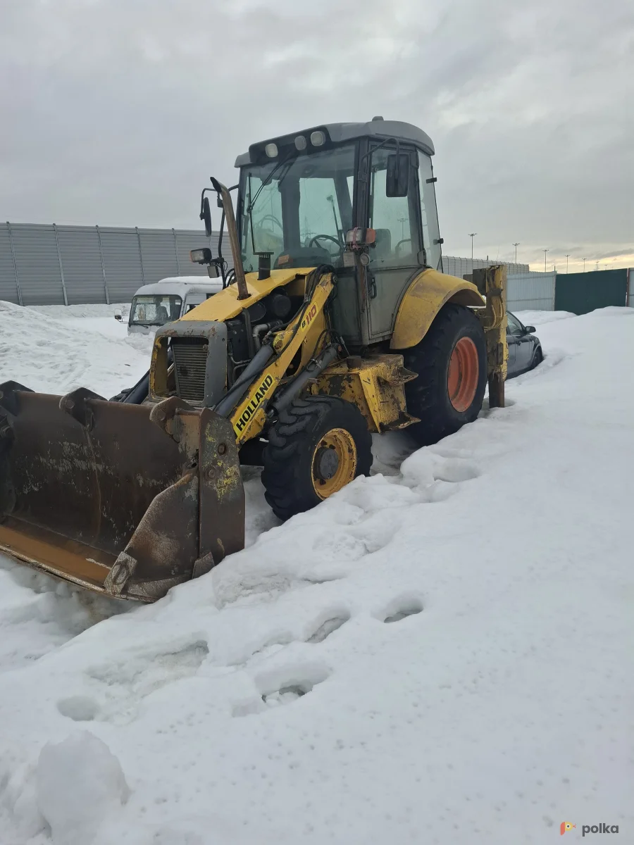 Возьмите Эскаватор погрузчик  напрокат (Фото 1) в Москве