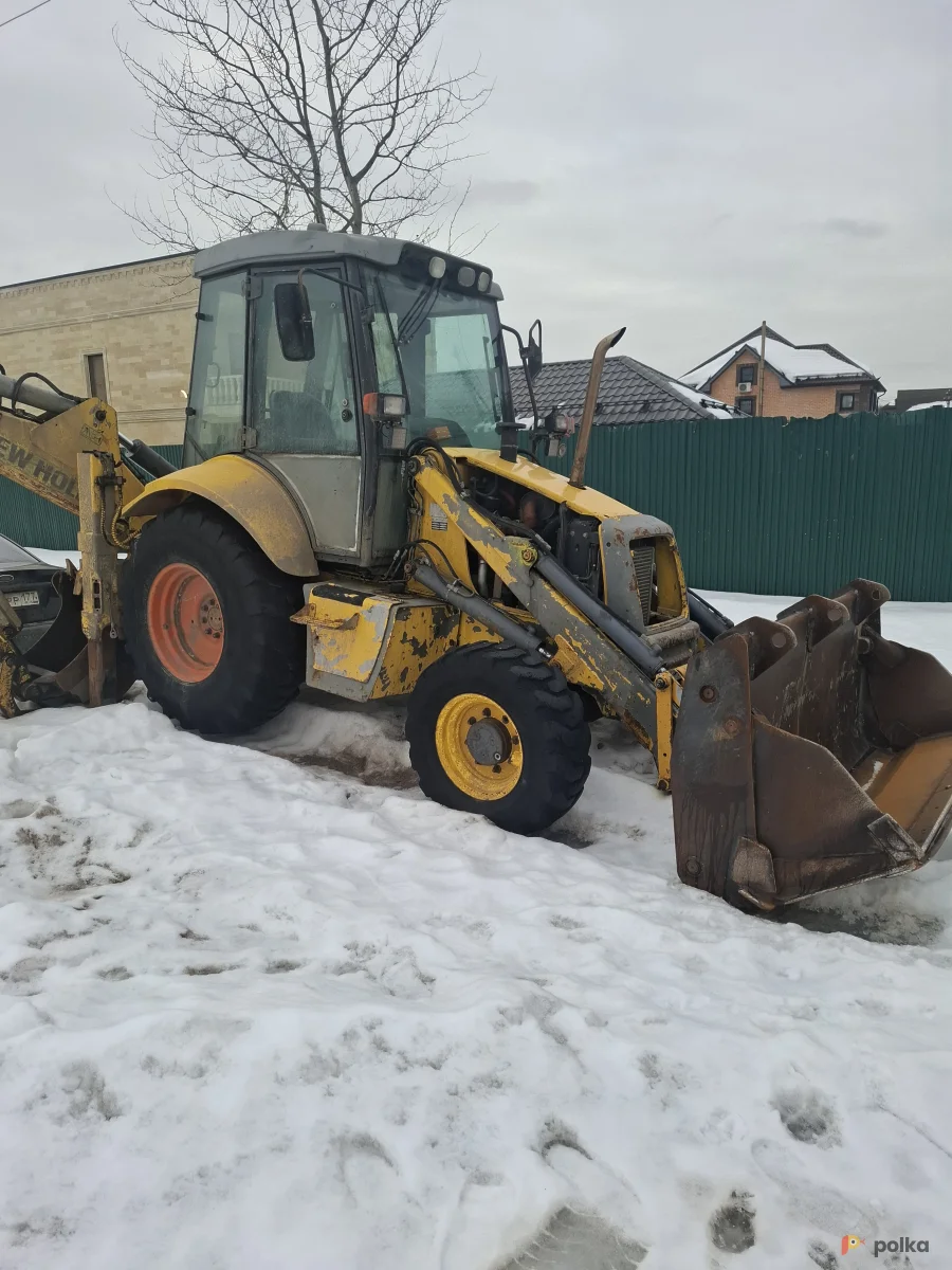 Возьмите Эскаватор погрузчик  New Holland B 110 напрокат (Фото 1) в Москве