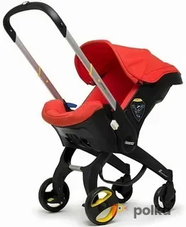 Возьмите Коляска-автокресло (автолюлька) Doona+ (0-13 кг)  (красный) напрокат (Фото 1) в Москве